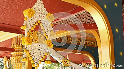 Floral decorations of oriental building. Beautiful flower compositions hanging on ceiling of ornamental building of. Floral interior decorations of oriental stock video footage
