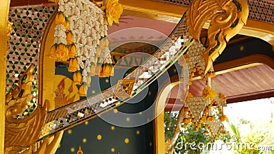 Floral decorations of oriental building. Beautiful flower compositions hanging on ceiling of ornamental building of. Floral interior decorations of oriental stock video