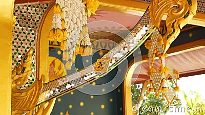 Floral decorations of oriental building. Beautiful flower compositions hanging on ceiling of ornamental building of. Floral interior decorations of oriental stock video footage