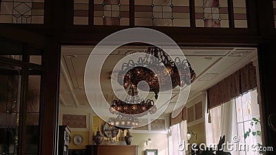 Incredibly beautiful unusual chandelier hanging on the ceiling. Very beautiful chandelier stock footage