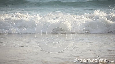 Large sea wave crashing sandy beach shore, telephoto close-up stock video