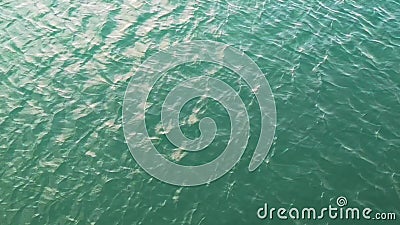 Ripple water in the ocean with the sunset reflection - relaxing background stock footage