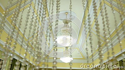 Vintage beautiful crystal chandeliers on the ceiling, large ceremonial hall.  stock footage