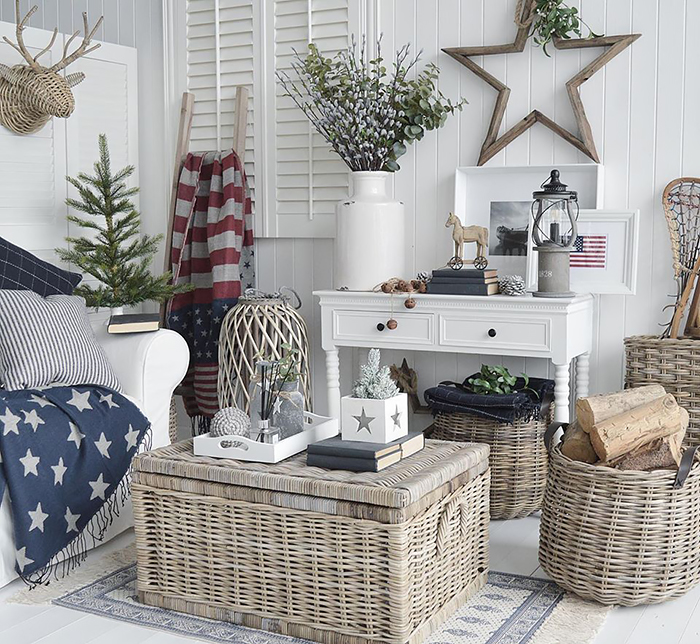 New England white furniture. Shows the white console table with two drawers as a sofa table in the white living room with accents of colour and stars and stripes