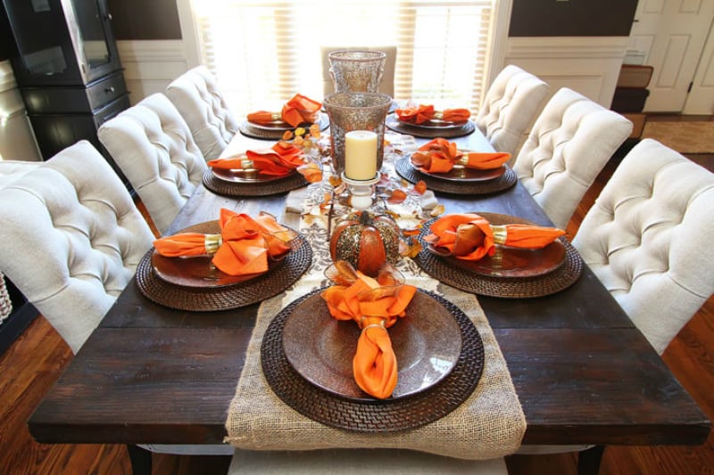 Orange napkins as accents in fall dining table decor